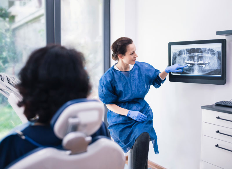 Dr reviewing x-rays with patient